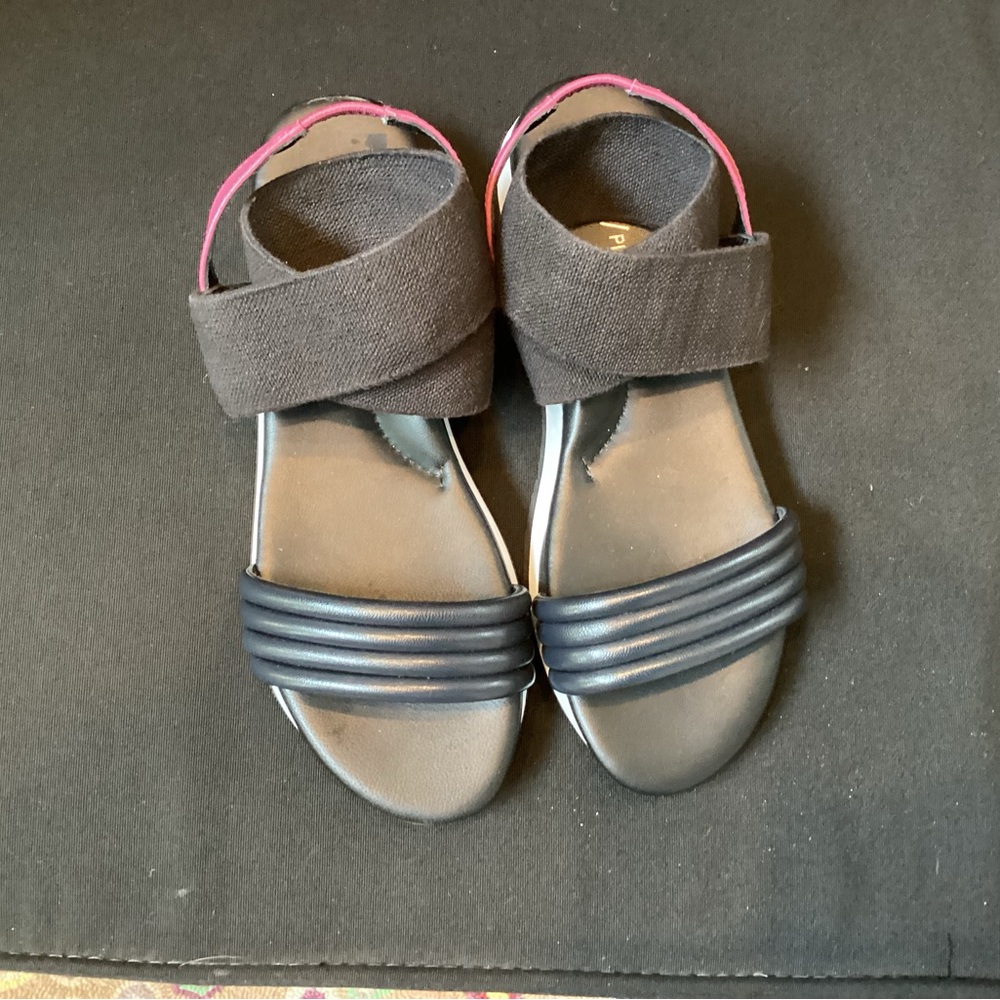 Dan Pilner Shaye black leather and stretchy textile sandals.